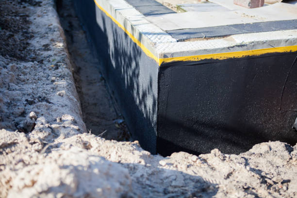 Professional Interior Drainage System technician working in East Amherst, NY